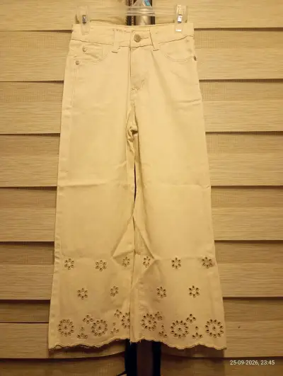 Pantalones beige con diseño floral bordado - miniatura 1