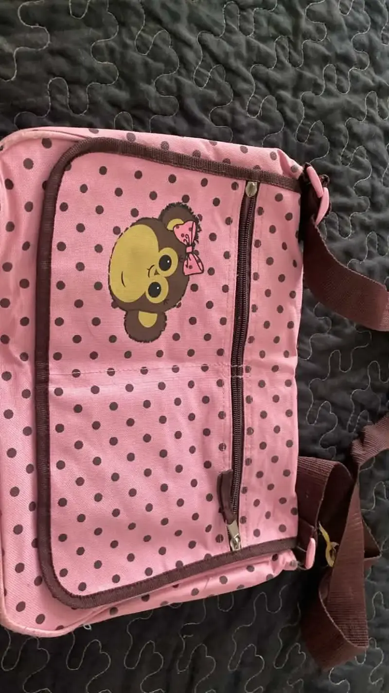 Bolsito polkadots rosa con diseño de monito