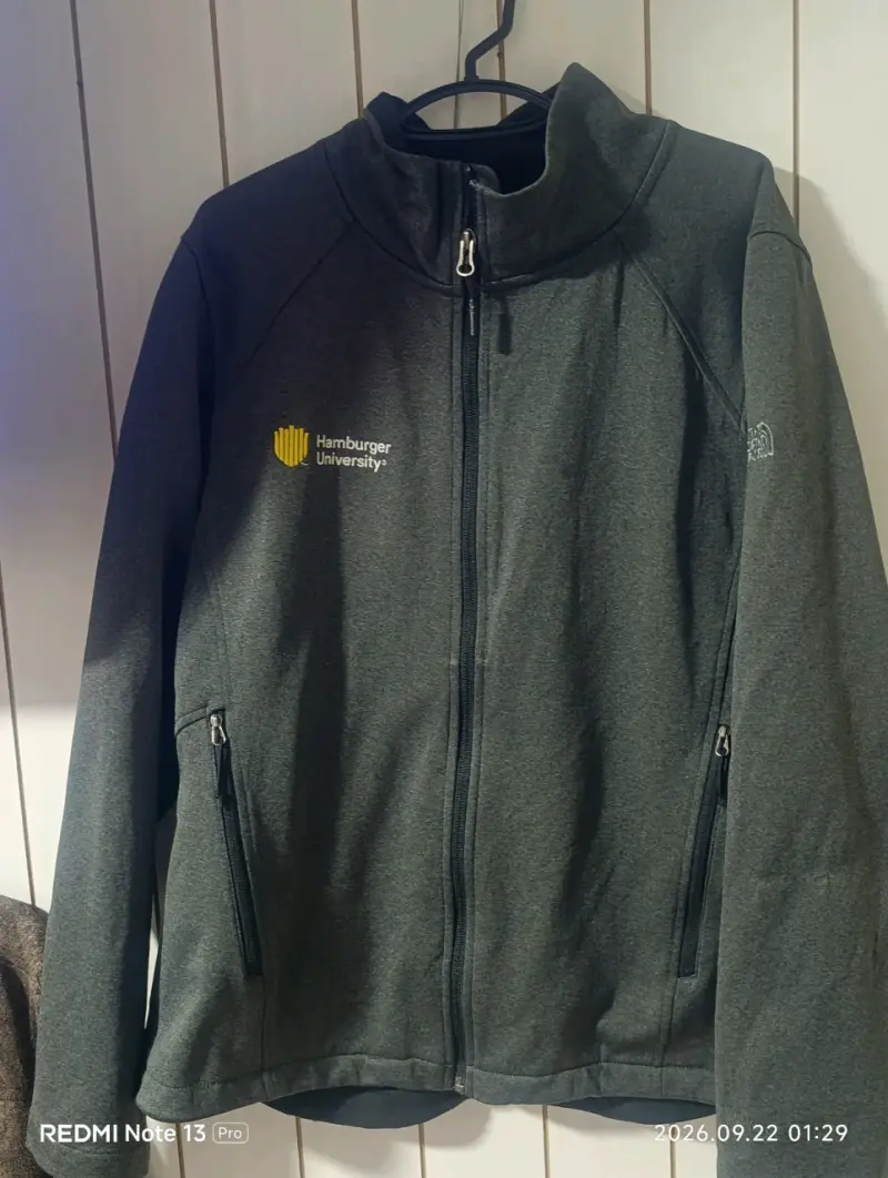 Chaqueta The North Face gris con logo bordado