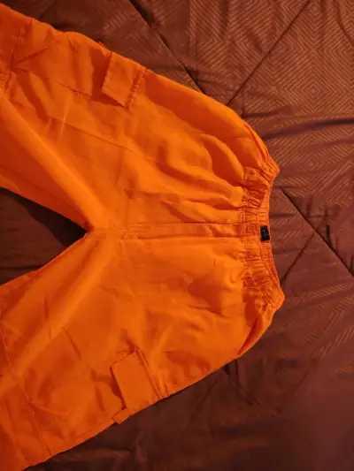 Pantalones naranjas de trabajo con bolsillos - miniatura 1