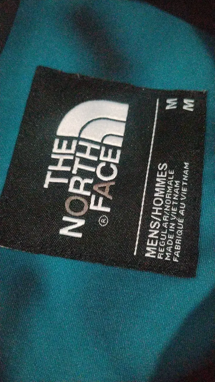 Chaqueta impermeable The North Face azul y negra - 2
