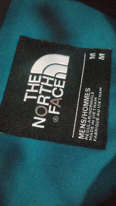 Chaqueta impermeable The North Face azul y negra - miniatura 2