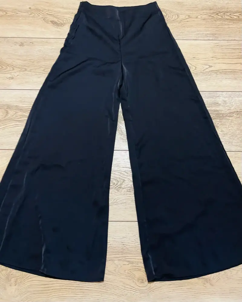 Pantalones elegantes anchos negros para mujer
