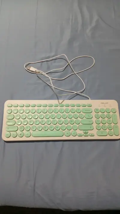 Teclado USB Delux con diseño ergonómico - miniatura 1