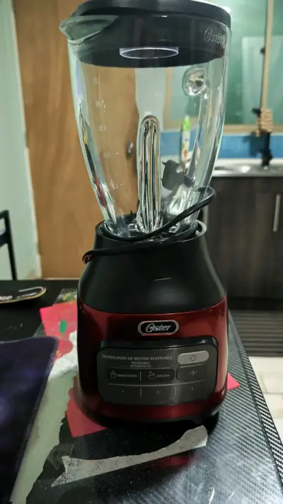 Licuadora Oster roja con motor reversible - miniatura 2