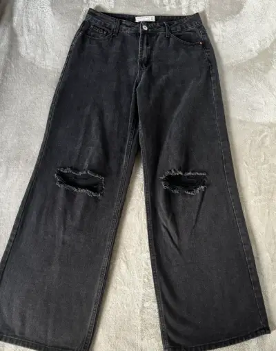 Jeans anchos negros con roturas - miniatura 1