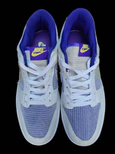 Zapatillas deportivas Nike blancas y moradas - miniatura 1