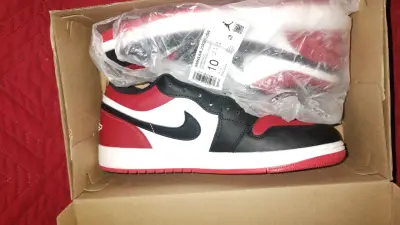 Jordan 1 low rojas y negras - miniatura 1