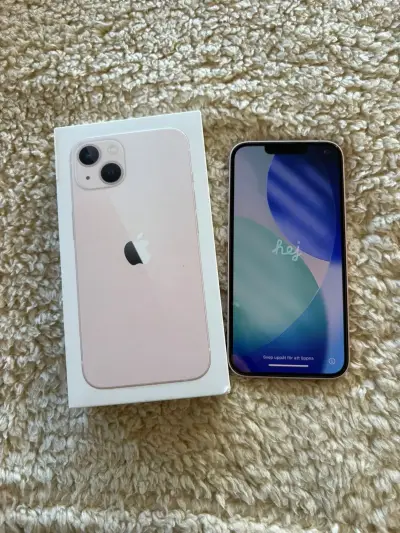 iPhone 13 en caja color rosa - miniatura 1