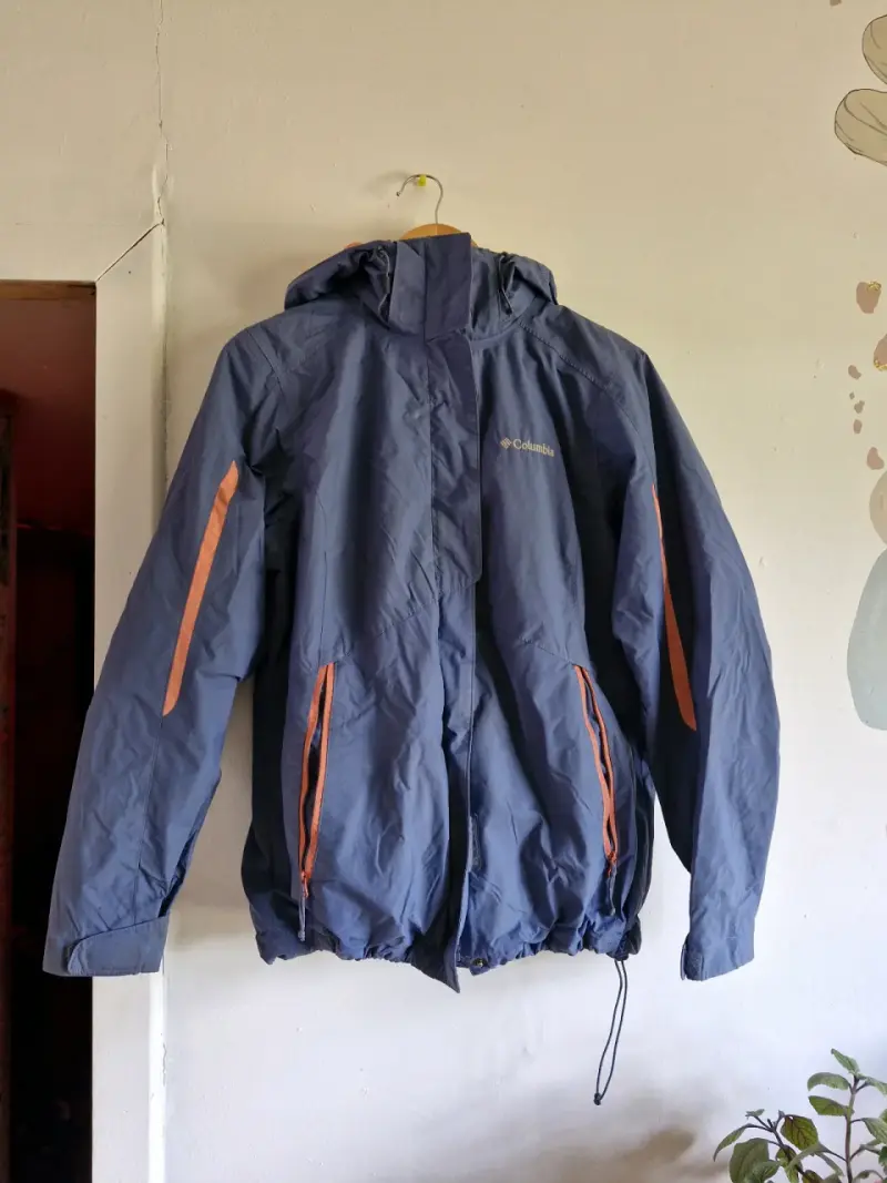Chaqueta impermeable Columbia azul con capucha - 1