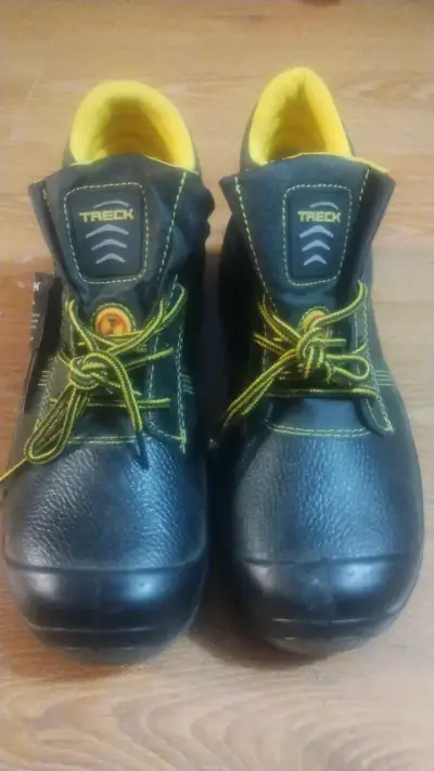 Botas de seguridad Treck negras con detalles amarillos - miniatura 1