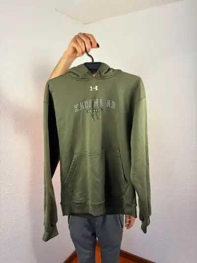 Polerón verde con capucha Under Armour - miniatura 1
