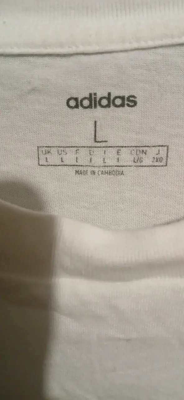 Polera Adidas blanca con diseño gráfico - 2