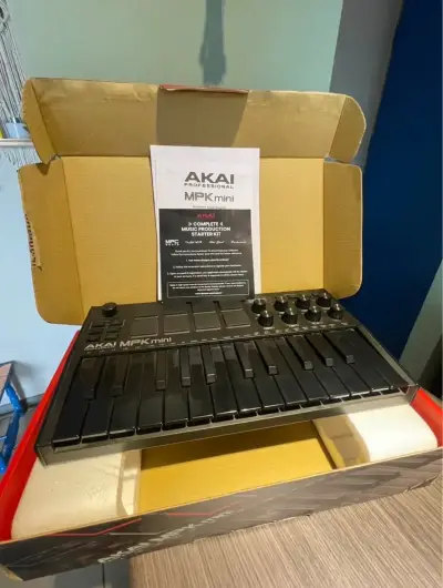 Controlador MIDI Akai MPK Mini con caja - miniatura 1