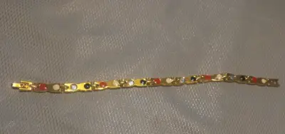 Pulsera magnética dorada con piedras de colores - miniatura 1