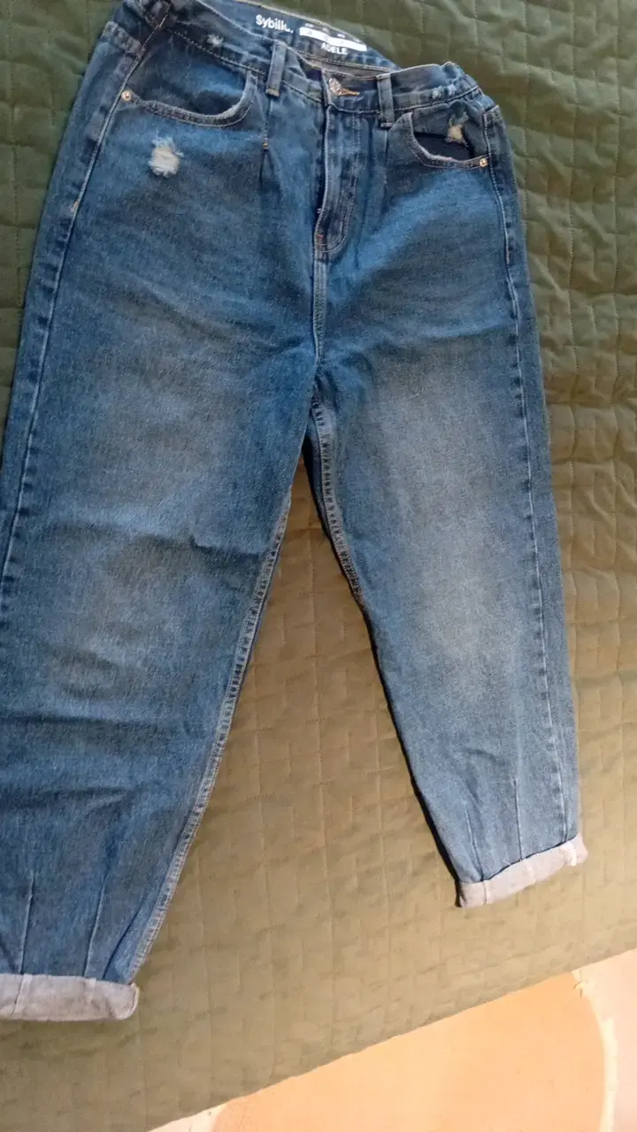Jeans de mezclilla azul desgastados para mujer