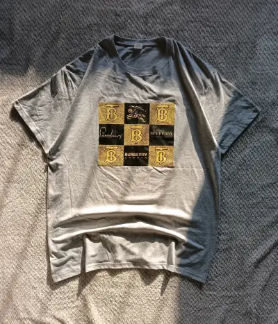 Polera gris Burberry - miniatura 1