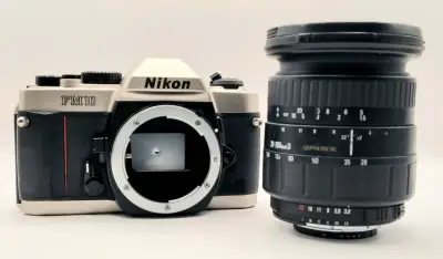 Cámara Nikon FM10 con lente 28-200mm - miniatura 1