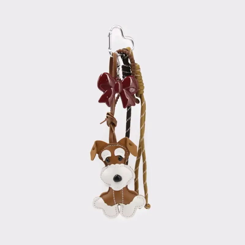 Llavero de perro con lazo decorativo