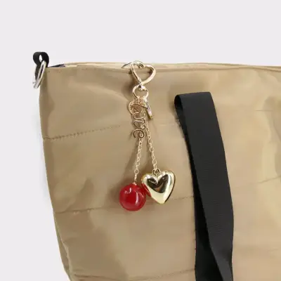 Llavero Dorado con Corazón y Esfera Roja - miniatura 2
