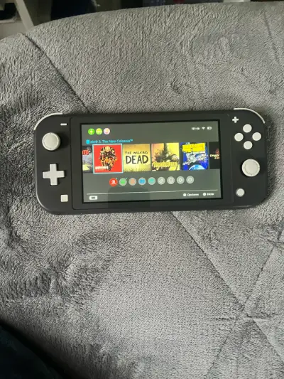 Nintendo Switch Lite gris en buen estado - miniatura 2