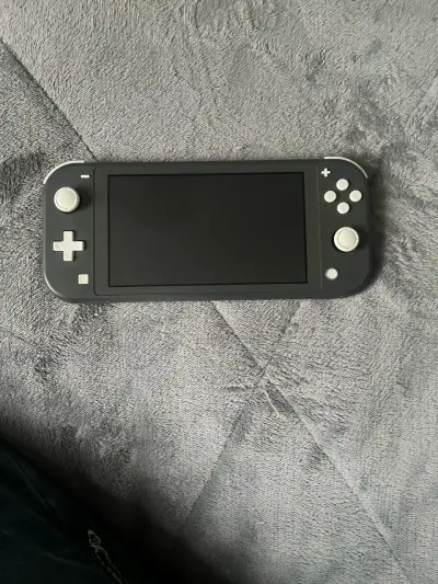 Nintendo Switch Lite gris en buen estado - miniatura 3