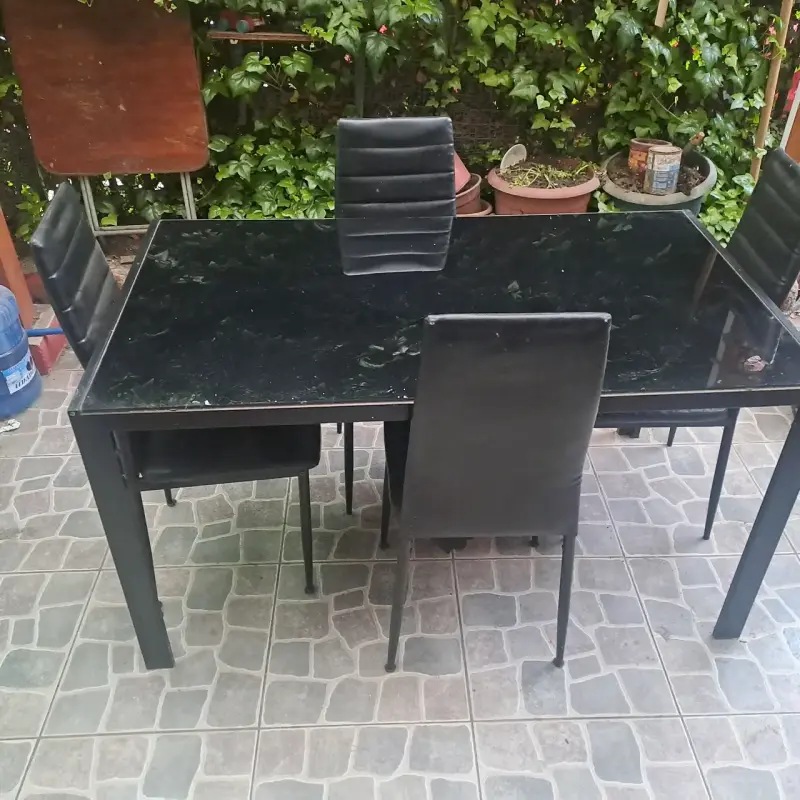 Juego de comedor de vidrio negro con sillas