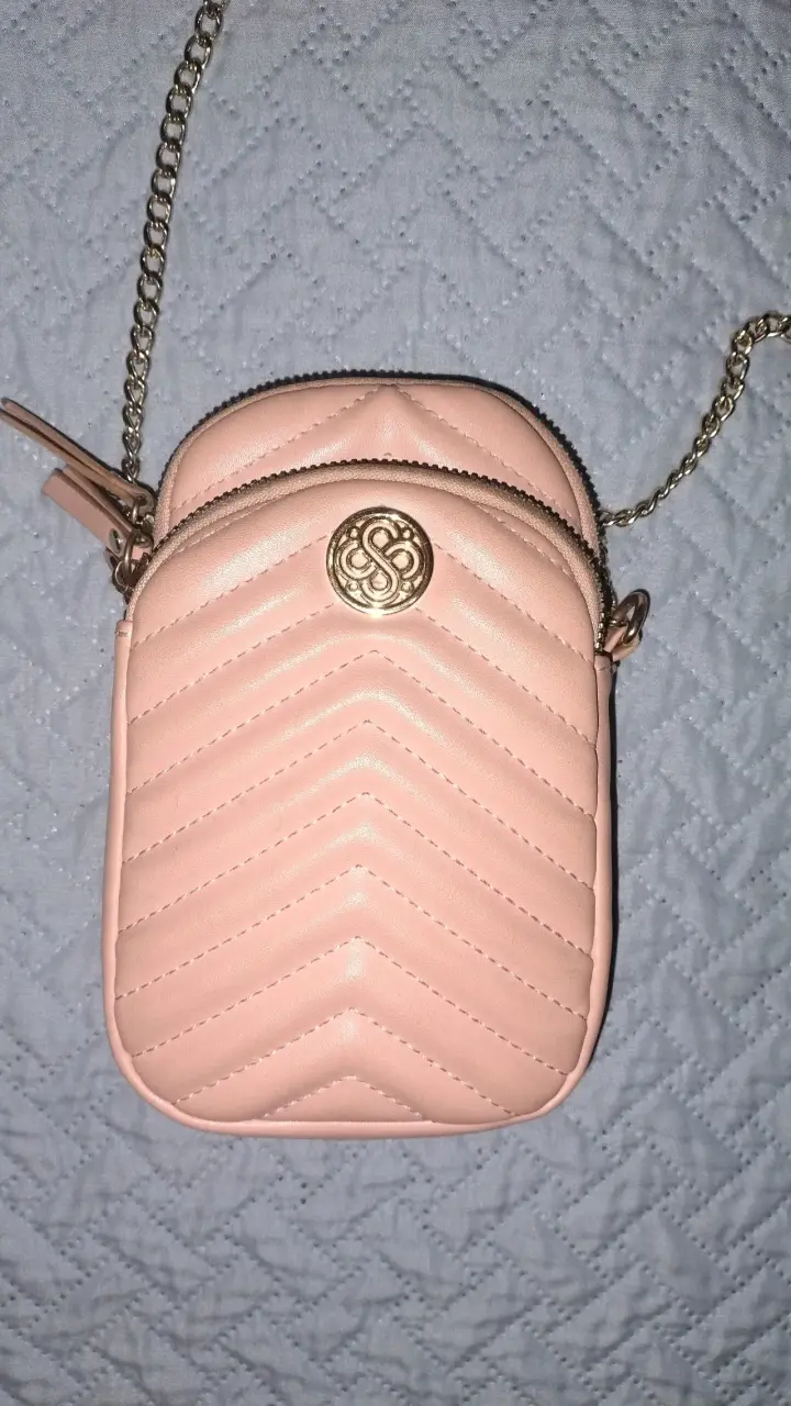 Bolso cruzado rosa con cadena dorada Secret