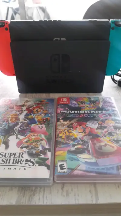 Consola Nintendo Switch con juegos Super Smash Bros y Mario Kart - miniatura 1