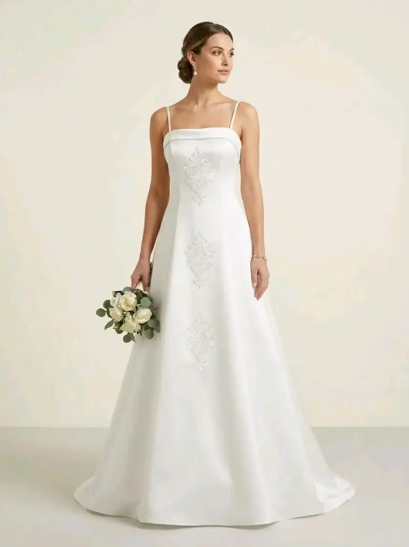 Vestido de novia blanco con bordados elegantes - 1
