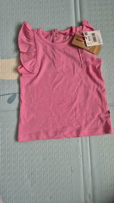 Polera rosa para niña con volantes - miniatura 1