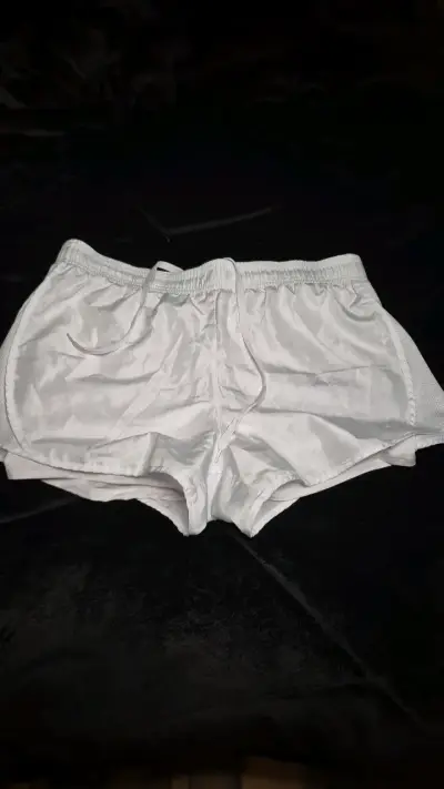 Shorts deportivos blancos RBX para hombre y mujer - miniatura 1