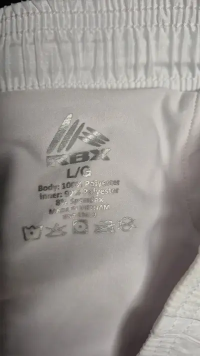 Shorts deportivos blancos RBX para hombre y mujer - miniatura 2