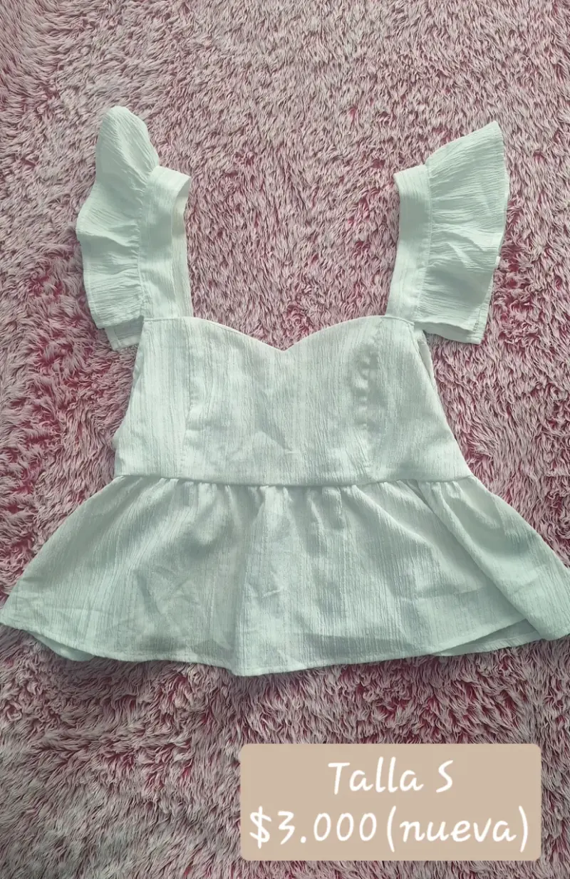 Blusa blanca con volantes talla S