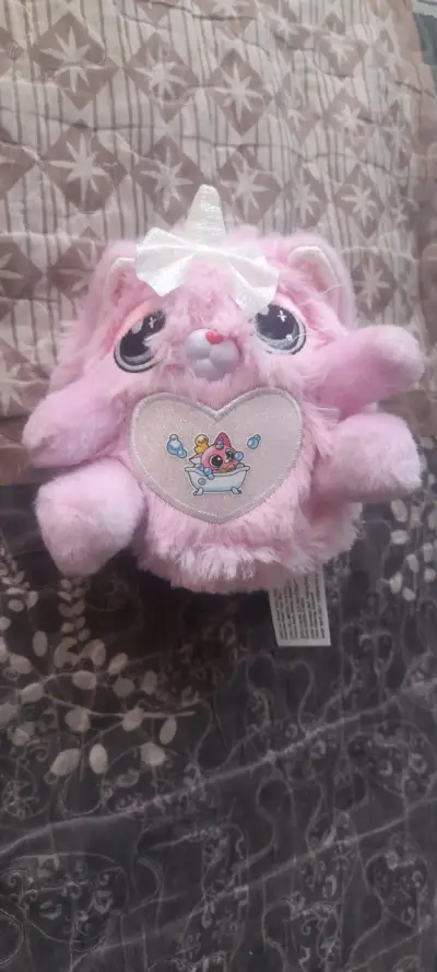 Peluche rosa con lazo y alas - miniatura 1
