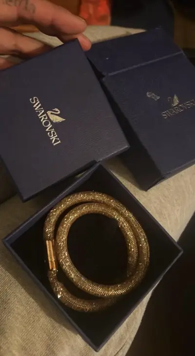 Pulsera Swarovski dorada en caja original - miniatura 2