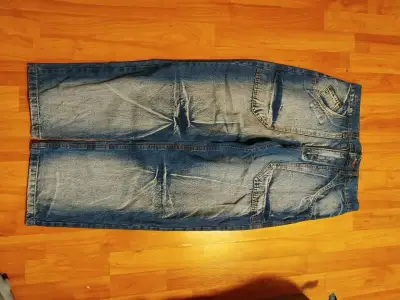 Jeans de mezclilla azul desgastados para hombre - miniatura 1