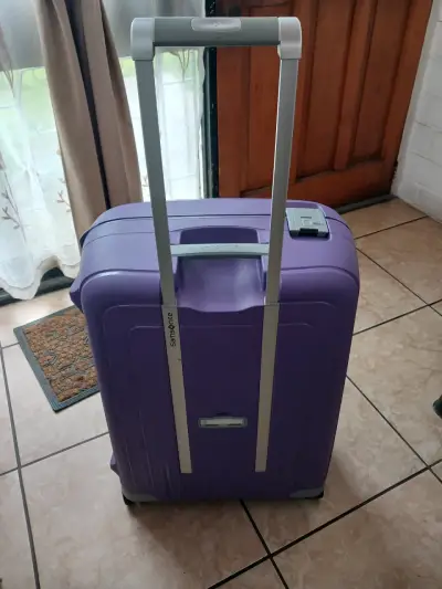 Maleta rígida morada Samsonite con ruedas - miniatura 1