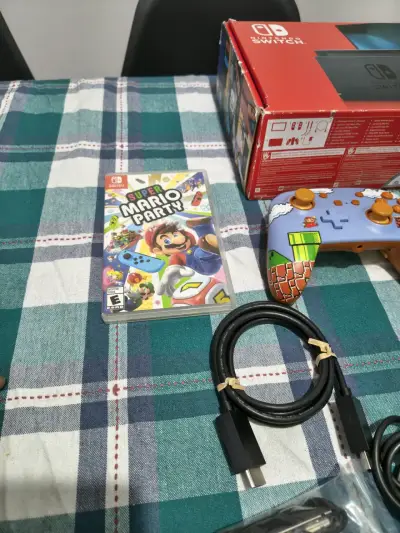 Consola Nintendo Switch con accesorios y juego Super Mario Party - miniatura 1