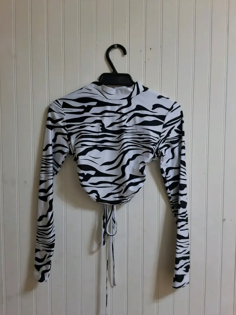 Top de manga larga con estampado de cebra