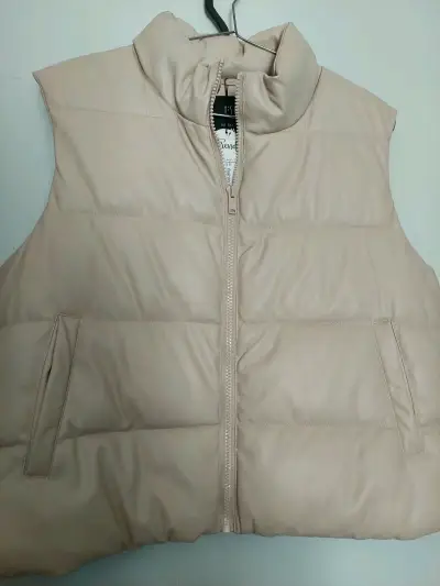 Chaleco acolchado beige sin mangas para mujer - miniatura 1