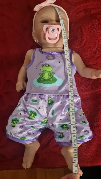 Muñeca bebé reborn con chupete y accesorios - miniatura 3