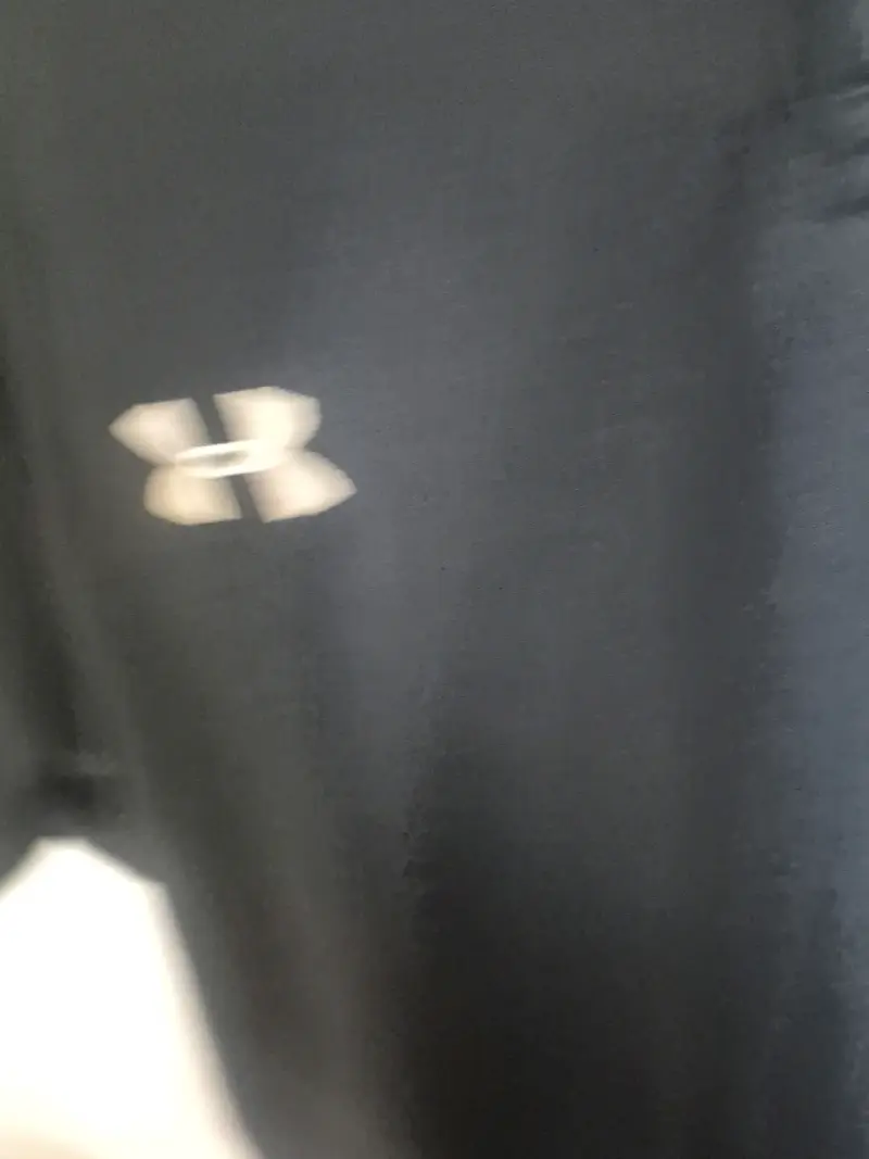 Polera polo negra Under Armour Caribbean Creme - 3