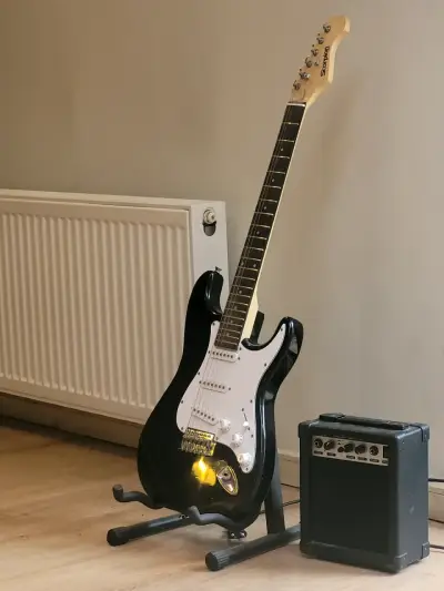 Guitarra eléctrica Scorpion negra con amplifica - miniatura 1