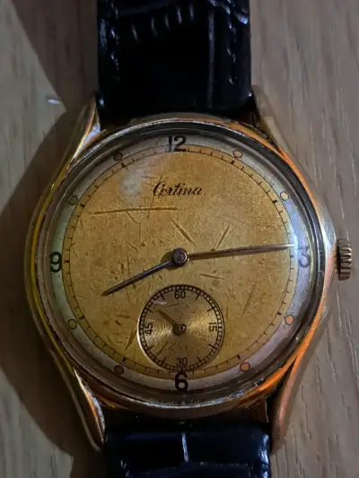 Reloj vintage Certina dorado con correa negra - miniatura 1